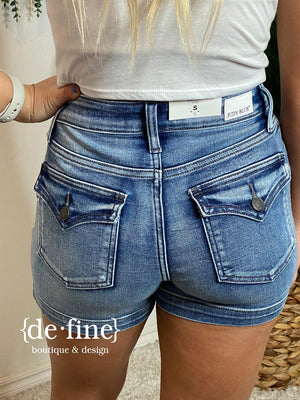 Judy Blue Mid Rise Flap Pocket Shorts in Regular & Curvy